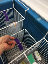 Load image into Gallery viewer, Hand removing product from the TempArmour Vaccine Refrigerator (Model BFRV84)
